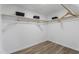 Walk-in closet with wood floor and shelving at 1309 N Holland Rd, Fuquay Varina, NC 27526