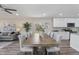 Open-concept dining area with a table and seating, open to the kitchen and living room at 1309 N Holland Rd, Fuquay Varina, NC 27526