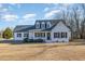 Charming one-story home with classic curb appeal, a covered porch, and well-maintained landscaping at 1309 N Holland Rd, Fuquay Varina, NC 27526