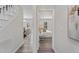 Hallway featuring wood-look floors leading to the bedroom and dining area at 1309 N Holland Rd, Fuquay Varina, NC 27526