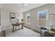 Cozy home office with modern decor, lots of natural light, and wood-look vinyl plank flooring at 1309 N Holland Rd, Fuquay Varina, NC 27526
