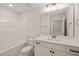 Bright bathroom featuring a combination shower and tub, and a single sink vanity at 140 Pilot Ridge Rd, Zebulon, NC 27597