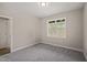 Bedroom featuring carpet flooring and a double-hung window at 140 Pilot Ridge Rd, Zebulon, NC 27597