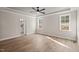 Bedroom with wood floors, crown molding, white trim and natural light at 140 Pilot Ridge Rd, Zebulon, NC 27597