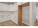 A kitchen features white cabinets, drawers and an open space for a fridge at 140 Pilot Ridge Rd, Zebulon, NC 27597