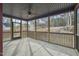 Covered and screened in back porch with ceiling fan at 140 Pilot Ridge Rd, Zebulon, NC 27597