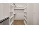 Spacious walk-in closet with custom shelving and ample storage space at 140 Pilot Ridge Rd, Zebulon, NC 27597