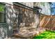 An enclosed patio area with brick siding, black trim, and an outdoor dining set at 1406 Lyon St # 101, Raleigh, NC 27608