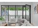 Bright balcony with comfortable seating and a view of the tree lined neighborhood at 1406 Lyon St # 101, Raleigh, NC 27608
