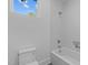 Bright bathroom featuring subway tile surround, bathtub and shower with tile niche at 1406 Lyon St # 101, Raleigh, NC 27608