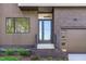 Contemporary home exterior with a brick accent wall, a modern door with sidelights, and a two-car garage at 1406 Lyon St # 101, Raleigh, NC 27608