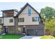 Stunning modern home showcasing unique architectural elements and a well-manicured lawn at 1406 Lyon St # 101, Raleigh, NC 27608