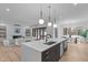 Open-concept kitchen seamlessly connecting to the living and dining areas at 1406 Lyon St # 101, Raleigh, NC 27608