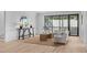 Bright living room with large windows and neutral color palette with access to outdoor balcony at 1406 Lyon St # 101, Raleigh, NC 27608