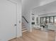 Bright, open-concept living room with hardwood floors and a modern fireplace at 1406 Lyon St # 101, Raleigh, NC 27608