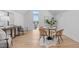Bright living room featuring hardwood floors, unique wicker chairs, and stylish decor at 1406 Lyon St # 101, Raleigh, NC 27608