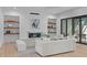 Living room boasts a fireplace, light colored furniture, floating shelves, and a sliding glass door at 1406 Lyon St # 101, Raleigh, NC 27608