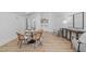 Bright living room featuring hardwood floors, unique wicker chairs, and stylish decor at 1406 Lyon St # 101, Raleigh, NC 27608