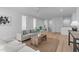Open living area with neutral tones, wood floors, and modern furnishings at 1406 Lyon St # 101, Raleigh, NC 27608