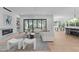 Elegant living room featuring a fireplace, contemporary furniture, and seamless indoor-outdoor flow at 1406 Lyon St # 101, Raleigh, NC 27608