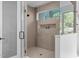 The oversized shower features a frameless glass door at 1406 Lyon St # 101, Raleigh, NC 27608