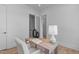 Bright office space with a wooden desk, patterned rug, and a comfortable desk chair at 1406 Lyon St # 101, Raleigh, NC 27608