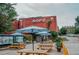 NOFO restaurant exterior view with outdoor seating and red brick building at 1406 Lyon St # 101, Raleigh, NC 27608