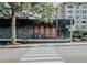 View of a modern Starbucks with brick and metal siding at 1406 Lyon St # 101, Raleigh, NC 27608