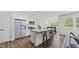 Bright, spacious kitchen features a granite island with seating and stainless steel appliances at 160 Scenic Rock Dr, Youngsville, NC 27596