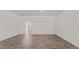 Open-concept living room with hardwood floors and natural light at 160 Scenic Rock Dr, Youngsville, NC 27596