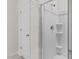 New bathroom featuring walk-in shower and a glass door at 160 Scenic Rock Dr, Youngsville, NC 27596