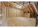 Unfinished attic space showing exposed wooden beams, ductwork, and subflooring at 1985 Meadowview Dr, Graham, NC 27253