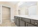 Bathroom with double vanity, tile flooring, and walk in closet at 1985 Meadowview Dr, Graham, NC 27253