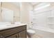 Bright bathroom featuring a shower and tub combination with sleek fixtures and a modern vanity at 1985 Meadowview Dr, Graham, NC 27253