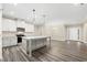 Spacious kitchen features an island with sink, granite countertops and stainless steel appliances at 1985 Meadowview Dr, Graham, NC 27253