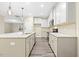Modern kitchen featuring white cabinets, granite countertops, island and stainless steel appliances at 1985 Meadowview Dr, Graham, NC 27253