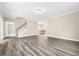 Spacious living room with hardwood flooring and staircase at 1985 Meadowview Dr, Graham, NC 27253