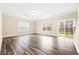 Bright and spacious living room with sliding glass doors and large windows at 1985 Meadowview Dr, Graham, NC 27253