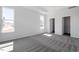 Spacious bedroom filled with natural light, carpeted flooring and a walk-in closet at 203 Frosted Iris Lane St # 181, Garner, NC 27529