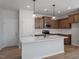 Modern kitchen featuring quartz countertops, stainless appliances, and hardwood floors at 203 Frosted Iris Lane St # 181, Garner, NC 27529