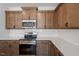 Well-equipped kitchen with stainless steel appliances, stylish cabinetry, and white subway tile backsplash at 203 Frosted Iris Lane St # 181, Garner, NC 27529