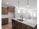 Modern kitchen featuring quartz countertops, stainless appliances, and hardwood floors at 203 Frosted Iris Lane St # 181, Garner, NC 27529