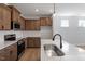 Modern kitchen with quartz countertops, stainless appliances, and subway tile backsplash at 203 Frosted Iris Lane St # 181, Garner, NC 27529