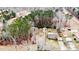 Aerial view of home, outbuilding, and wooded lot at 2104 Live Oak Dr, Sanford, NC 27330