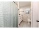 A full bathroom features a shower and toilet with tile flooring at 2104 Live Oak Dr, Sanford, NC 27330
