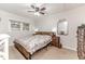Comfortable bedroom with carpeted floors, a ceiling fan and plenty of natural light at 2104 Live Oak Dr, Sanford, NC 27330