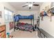 A bedroom with a bunk bed, a window and a ceiling fan at 2104 Live Oak Dr, Sanford, NC 27330