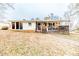 Exterior view of home with back patio and landscaped yard at 2104 Live Oak Dr, Sanford, NC 27330