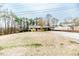 Ranch-style home featuring a large front yard and covered carport at 2104 Live Oak Dr, Sanford, NC 27330