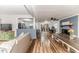 Comfortable living room with hardwood floors, open kitchen view, and dining table at 2104 Live Oak Dr, Sanford, NC 27330